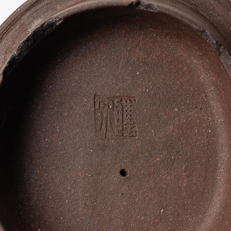 A Chinese 'hundred-fruit' yixing teapot, Qing dynasty (1644-1912).