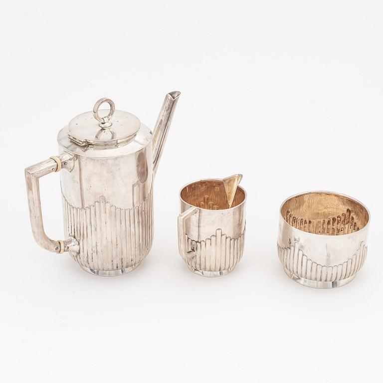 A Swedish silver coffee pot, creamer and sugar bowl, Stockholm 1908.