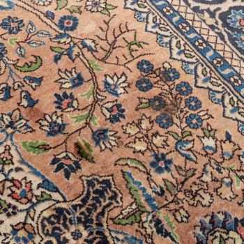 An oriental rug, circa 245 x 136 cm.