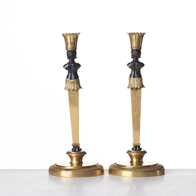 A pair of Empire style candlesticks. Late 19th century.