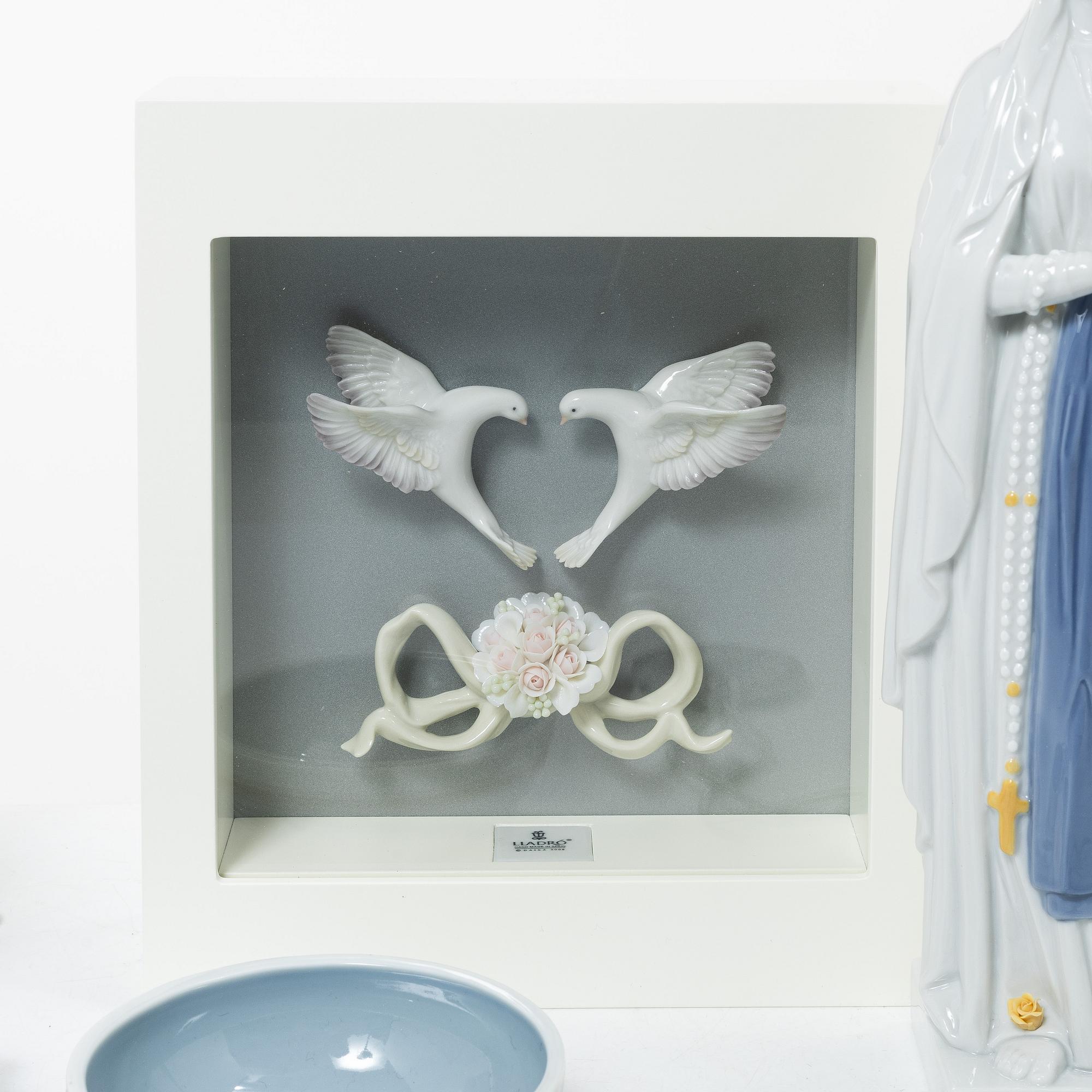 Lladró, a collection of figurines etc. Including "Romantic doves - wall art", "Sitting in heaven", "Our lady of Lourdes".