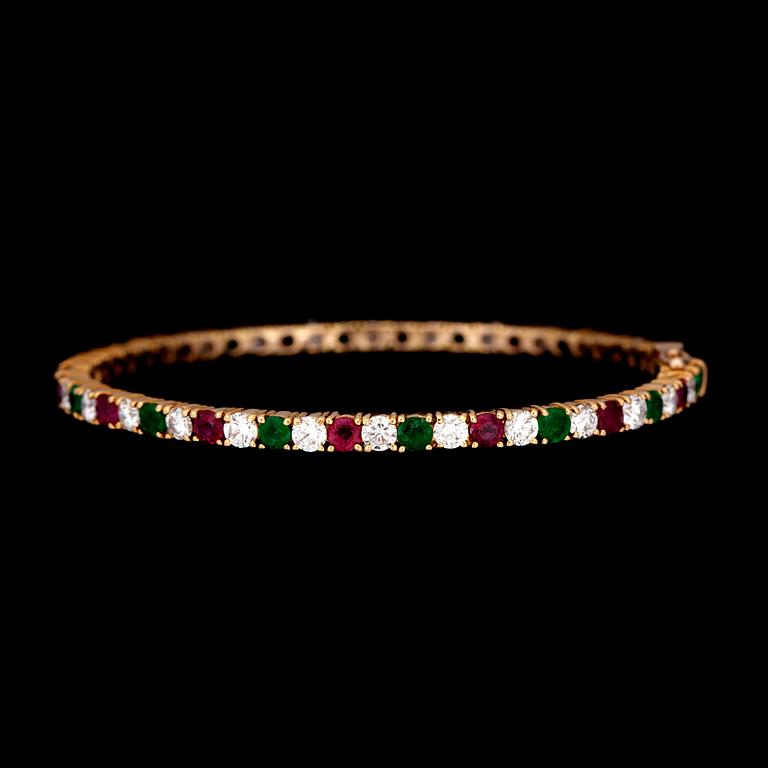 A diamond, circa 4.20 cts in total, ruby and emerald bracelet.