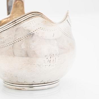A Georgian sterling silver jug, late 18th century. Worn marks.
