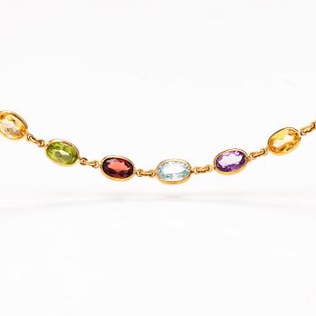 An 18K gold necklace and bracelet with garnets, peridotes, topazes, citrines and amethysts. Le-Gi, Italy.