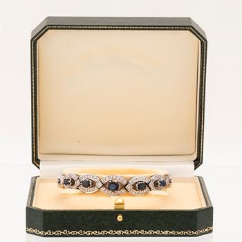 An 18K white gold bracelet set with oval faceted sapphires and brilliant-cut diamonds, Stockholm.