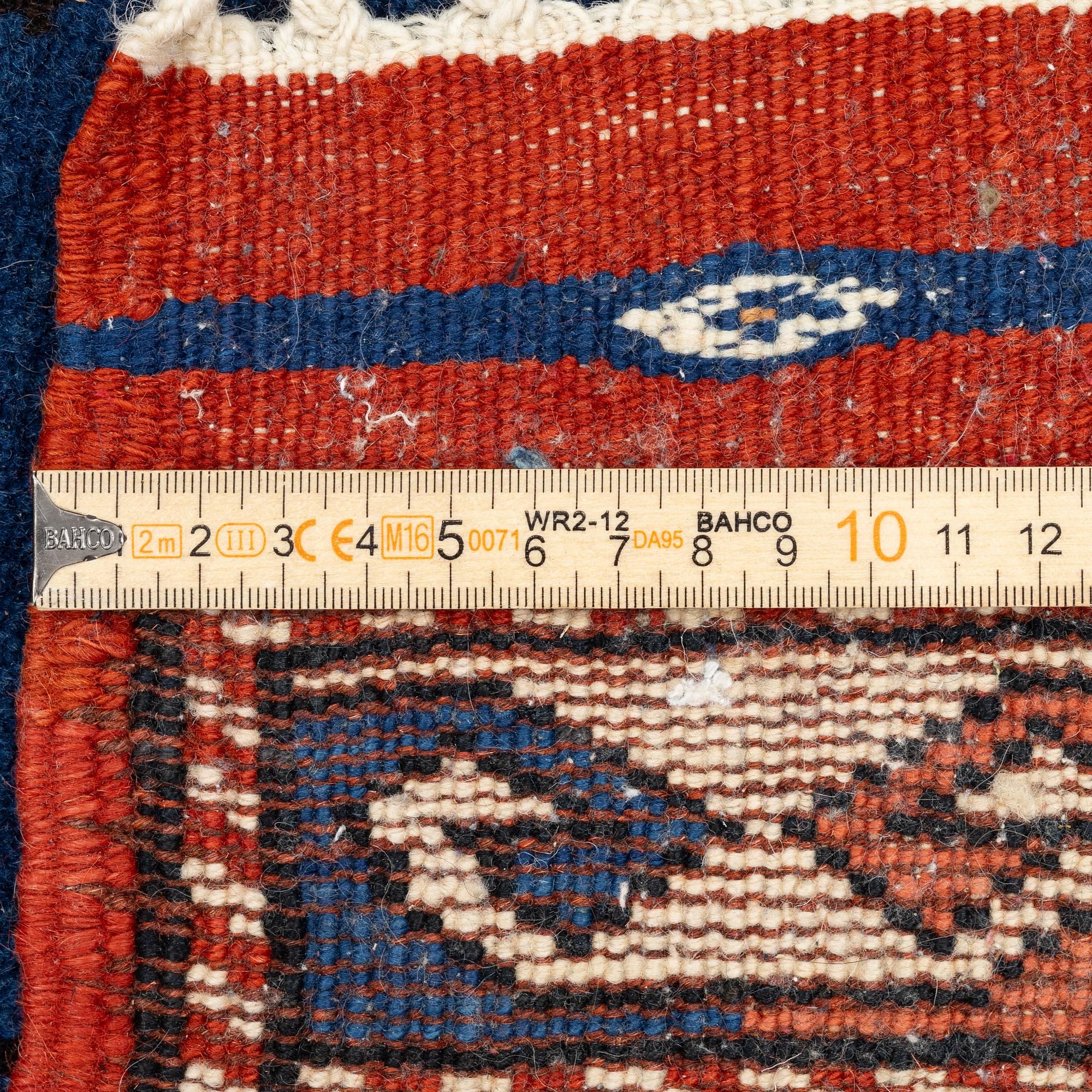 A semi-antique Turkish rug, 175 x 123 cm.