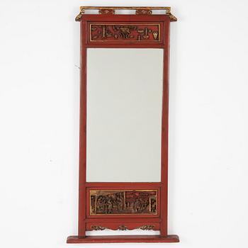 A lacquered mirror, Qing dynasty, 19th century.