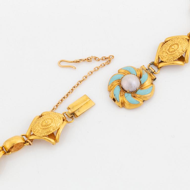 An 18K gold and enamel necklace set with pearls and half pearls.