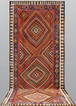 A persian nomadic kilim, approximately 420 x 190 cm.