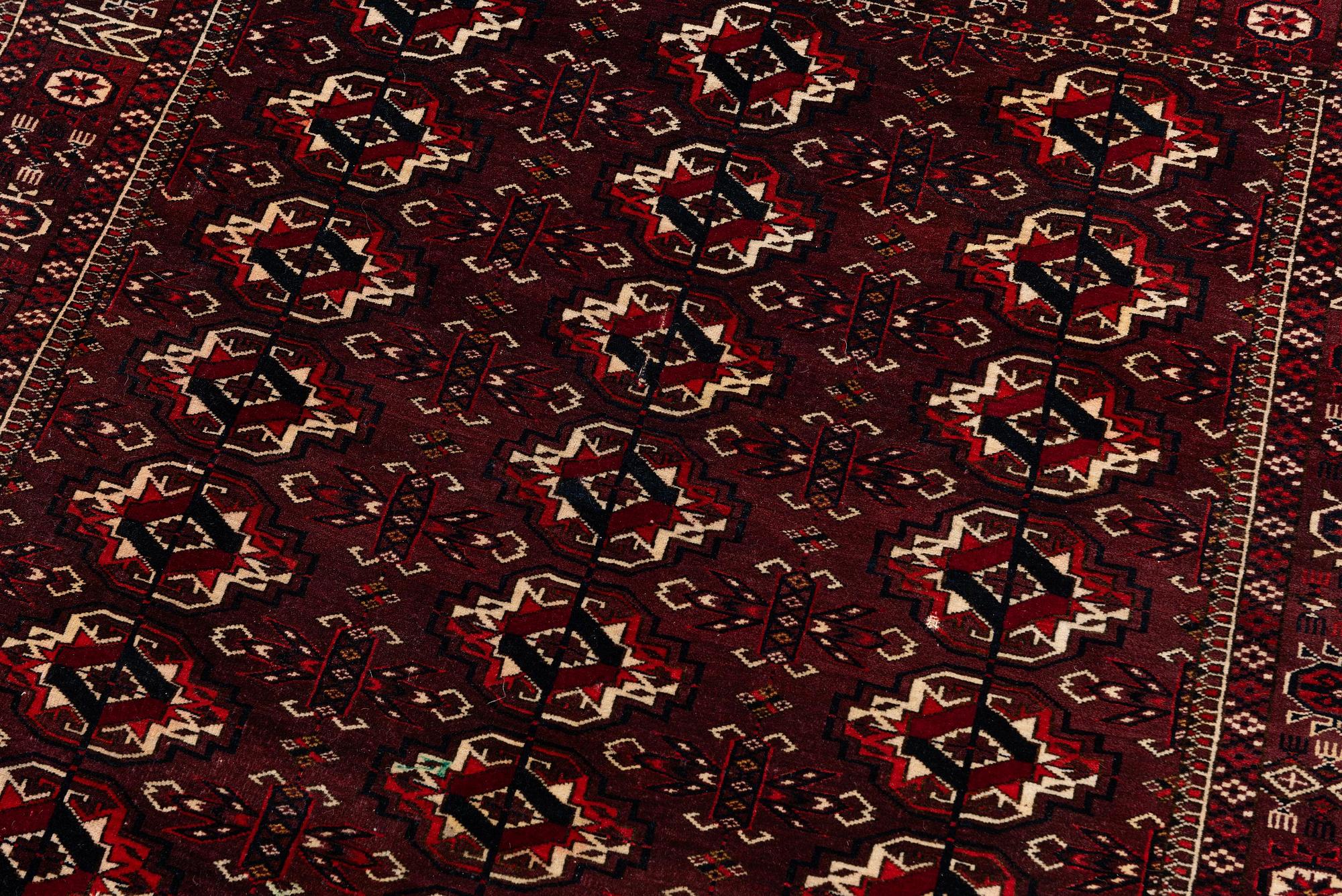 An antique Yomut rug, Western Turkmenistan, c. 119 x 104 cm.
