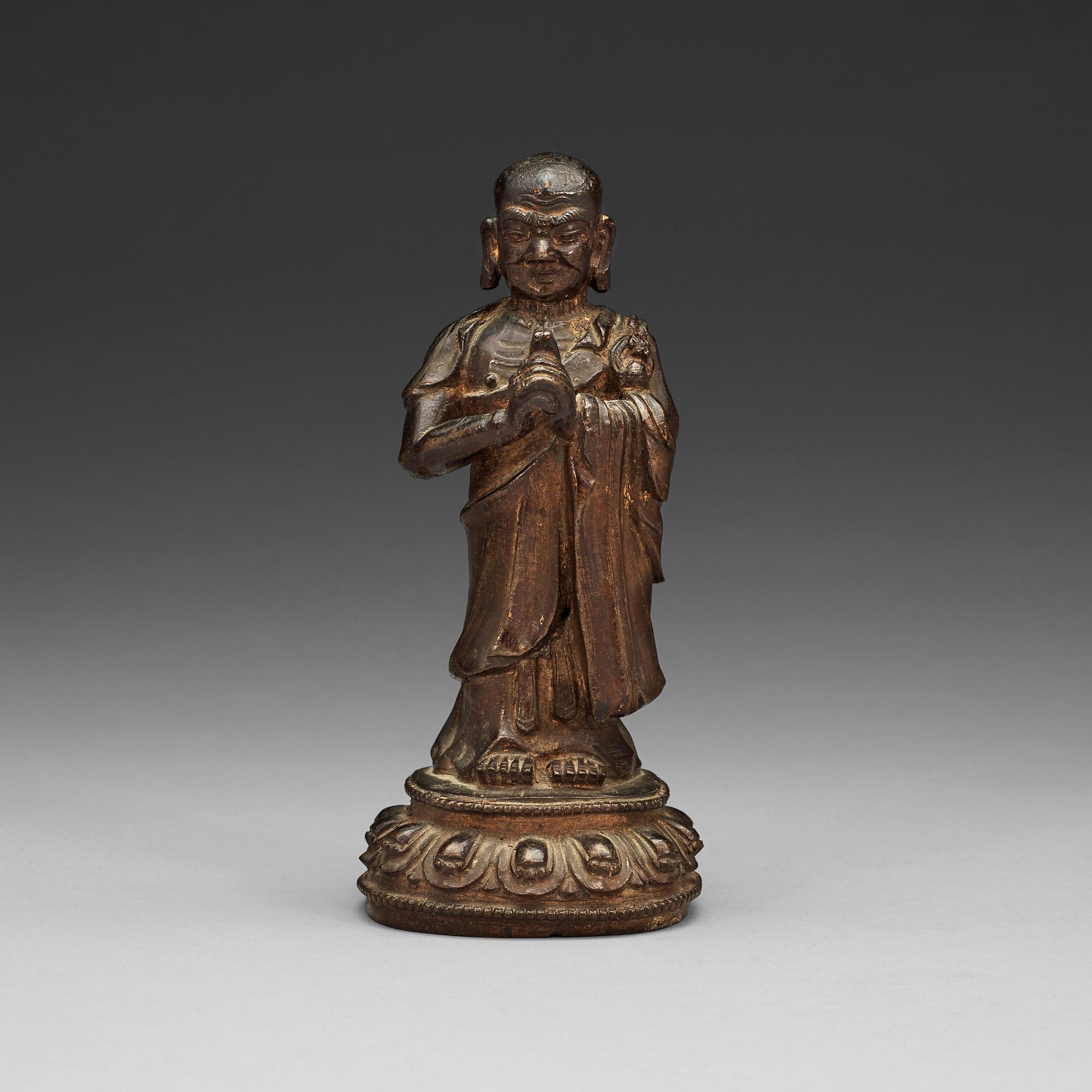 A bronze figure of a Lohan, Ming dynasty, 17th Century.