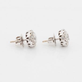 A pair of 18K white gold earrings.