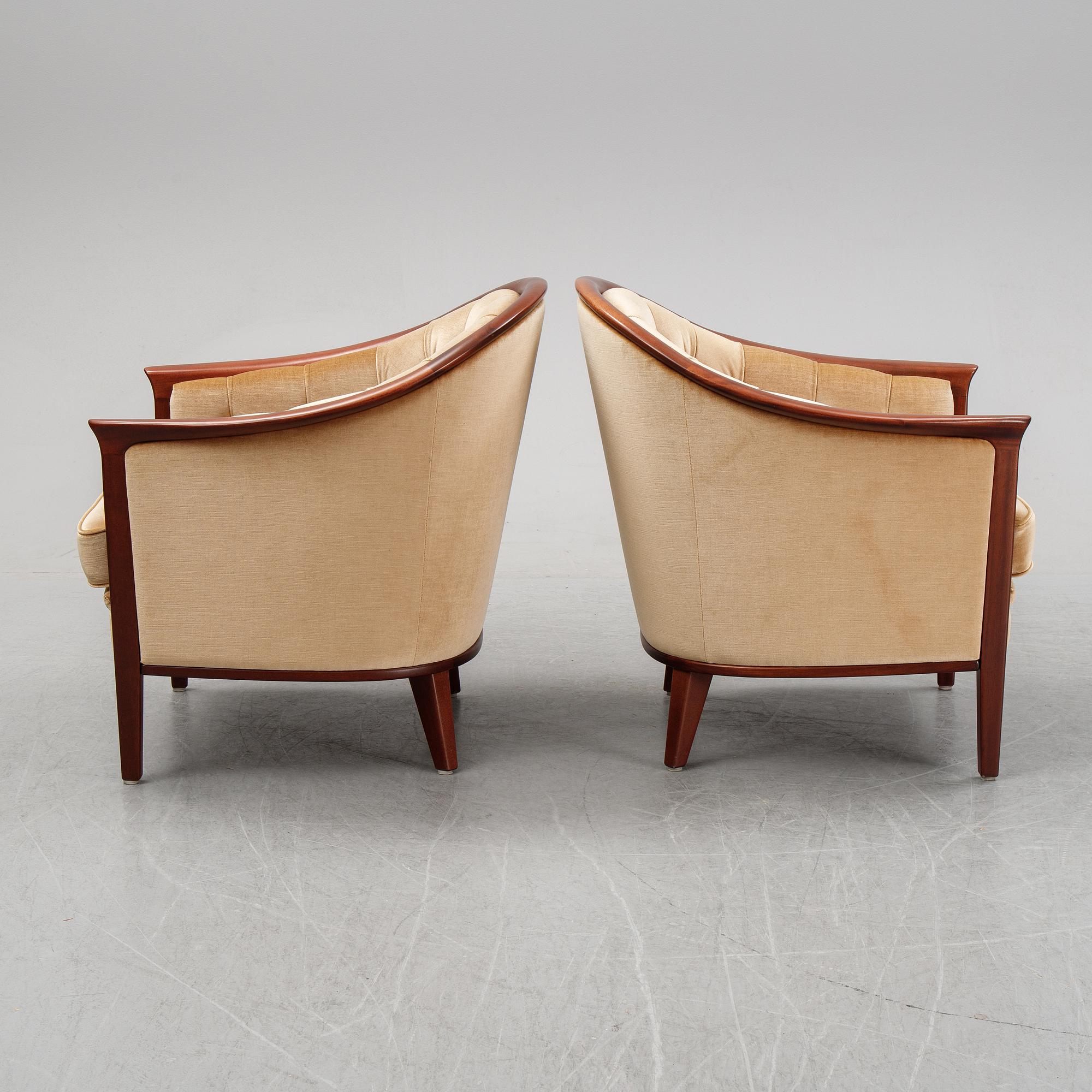 A pair of mahogany and velvet easy chairs by Bröderna Andersson, 1960's.