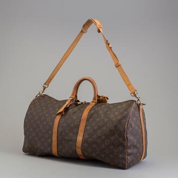 A Keepall Bandouliere 55 WEEKEND BAG by Louis Vuitton.