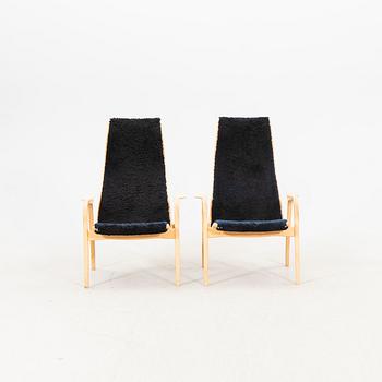 Yngve Ekström, a pair of lamino easy chairs from Swedese later part of the 20th century.