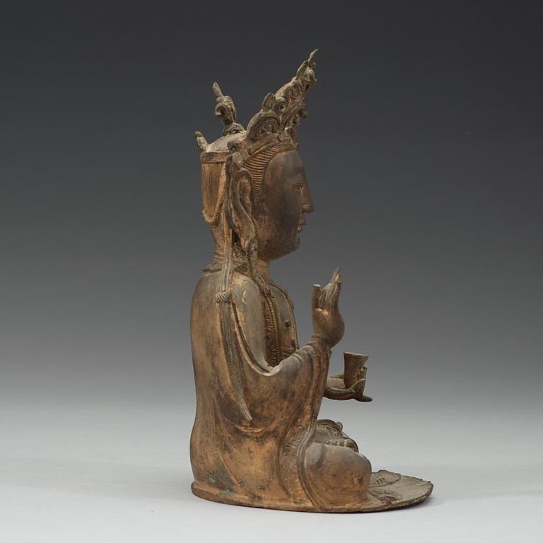 A seated bronze sculpture of Guanyin, late Ming dynasty.