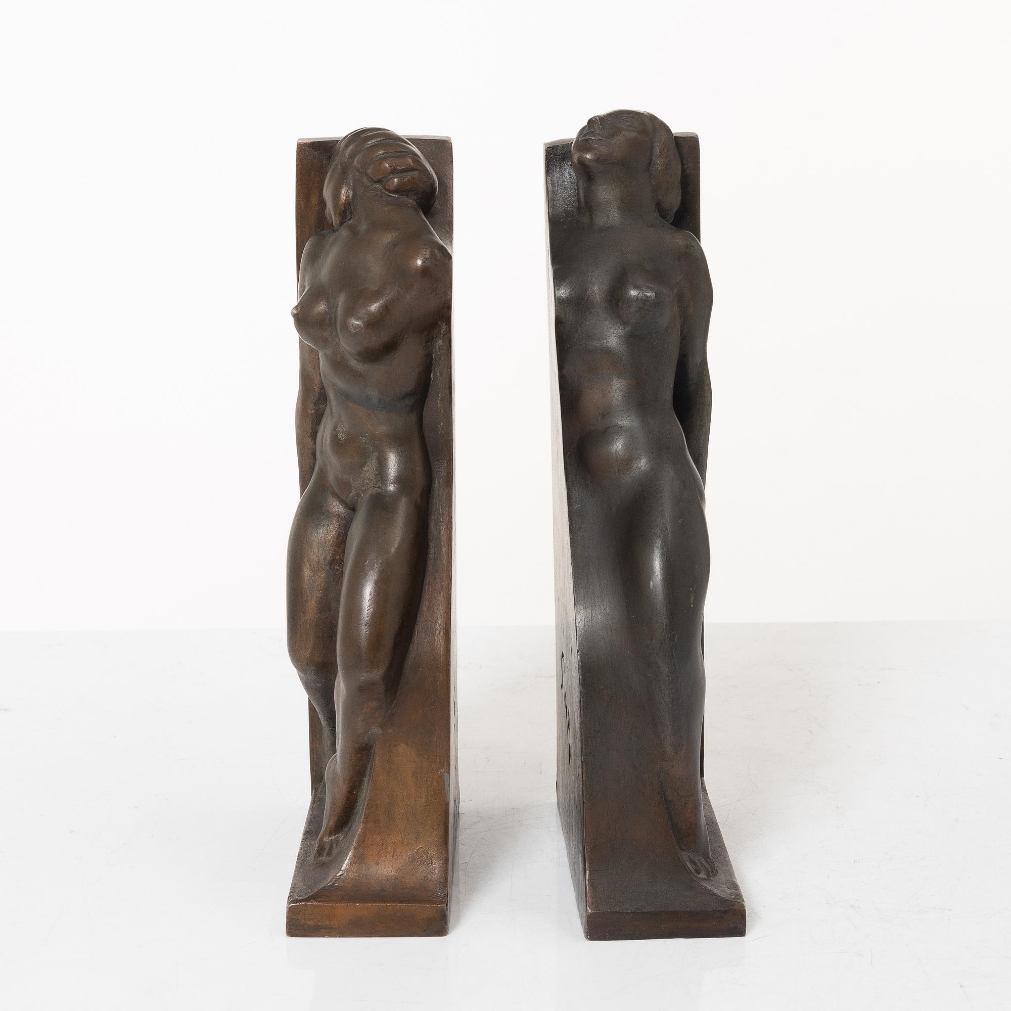 Axel Gute, two patinated metal bookends.