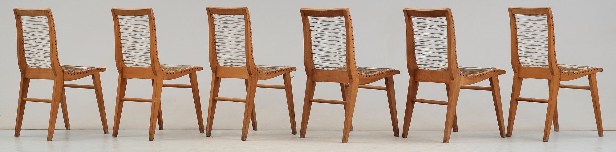 A Louis Sognot set of six ash, metal and rubber chairs, France 1950's.
