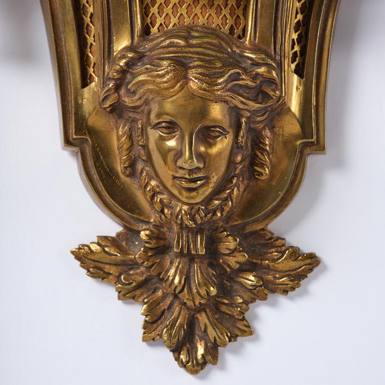 A French  Louis XVI-style wall clock, around 1900.
