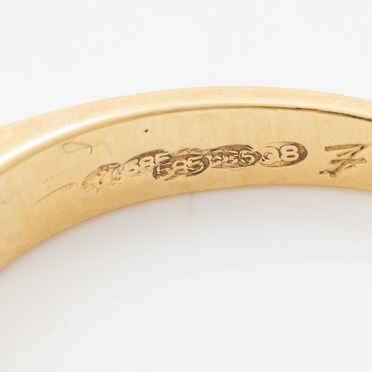 14K gold ring with princess-cut diamonds.