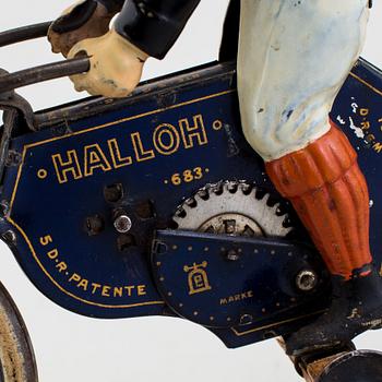 A partially hand painted tinplate Lehmann Halloh motorcycle, Germany. In production 1914-41.