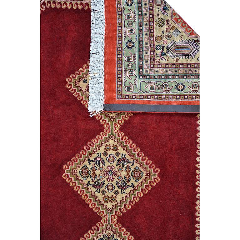 A Persian Rug, approximately 240 x 165 cm.
