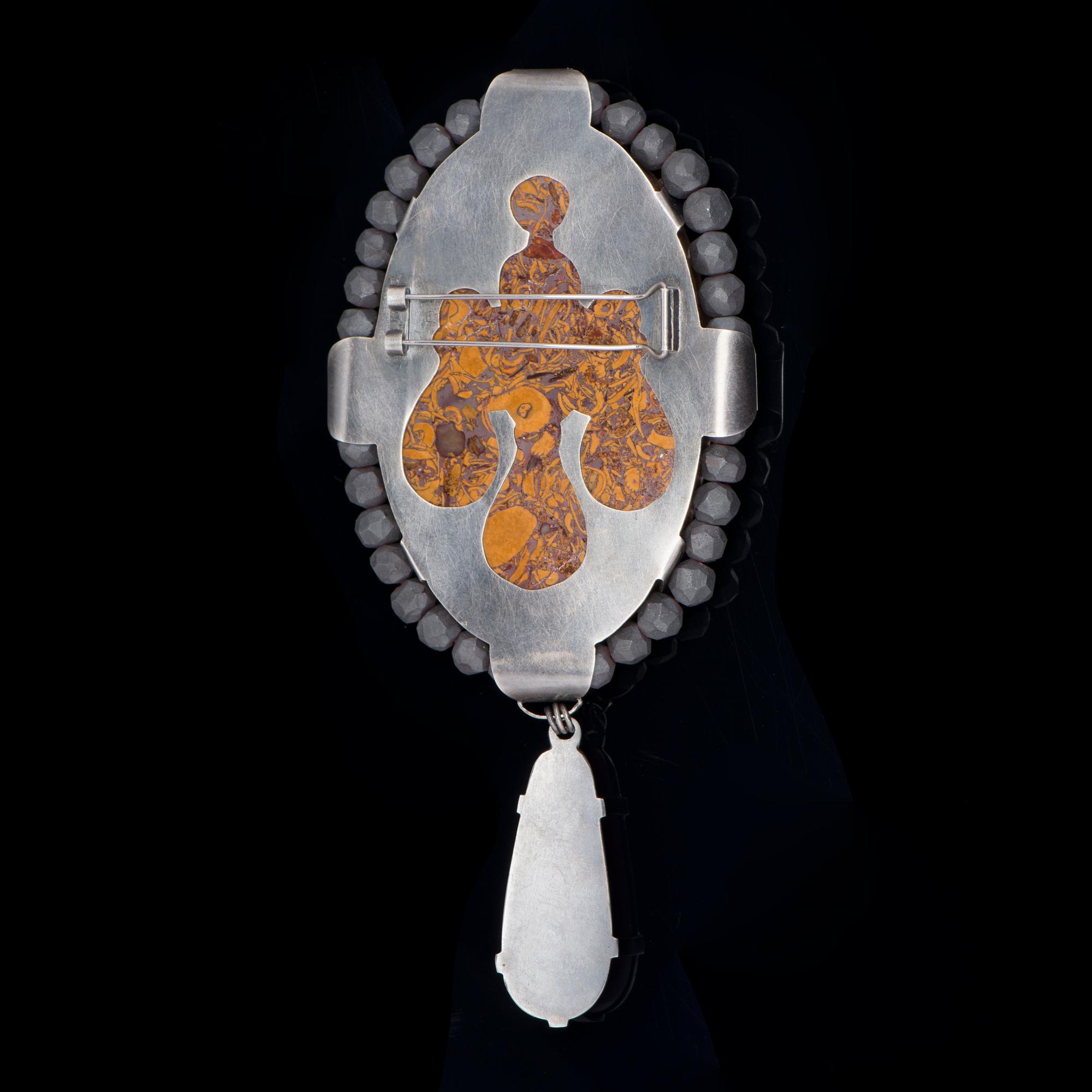 ULLA AHOLA, BROOCH, silver, jasper, hematite, synthetic ruby, 2008.