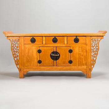 A Chinese elmwood sideboard, from around the turn of the century 1900.