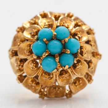 An 18K gold ring with glass stones.