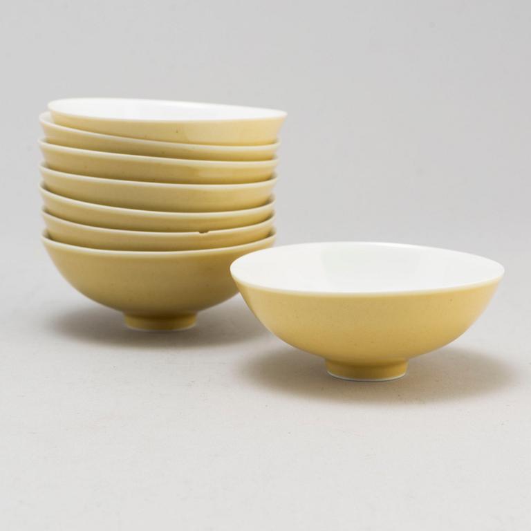 Eight Chinese yellow glazed bowls, late 20th century.