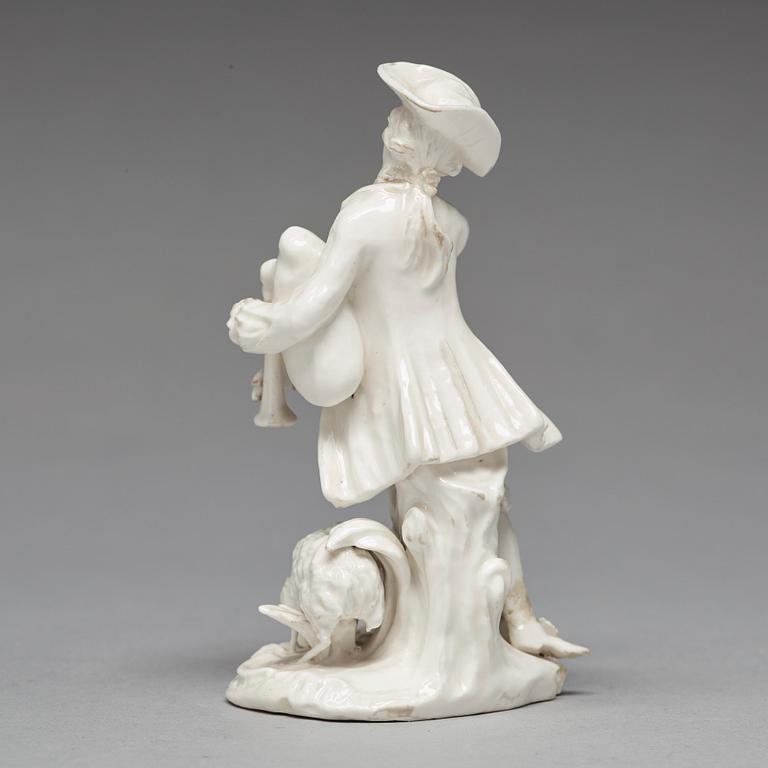 A Swedish Marieberg soft paste figure of a bag-piper, 18th Century.