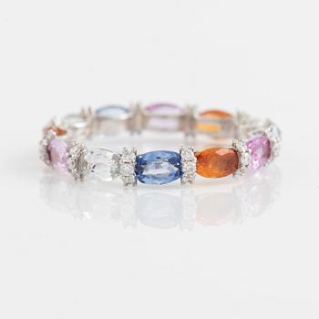 Multi coloured sapphire and brilliant cut diamond ring.