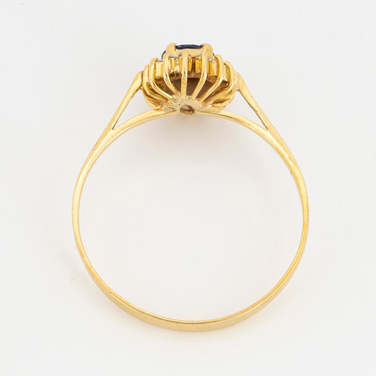 Oval mixed-cut sapphire and round brilliant-cut diamond halo ring.