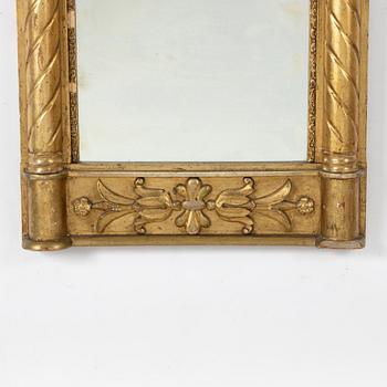 An empire style mirror, second half of the 19th century.