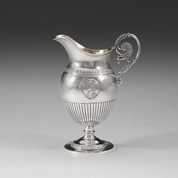 1019. A Swedish 19th century parcel-gilt cream-jug, marks of Magnus Fryberg, Jönköping 1825.