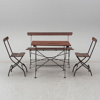 A garden sofa, table and a pair of chairs, first half of the 20th century.