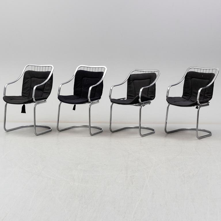 An Italian set of a glass table with four chromed metal chairs, 1970s.