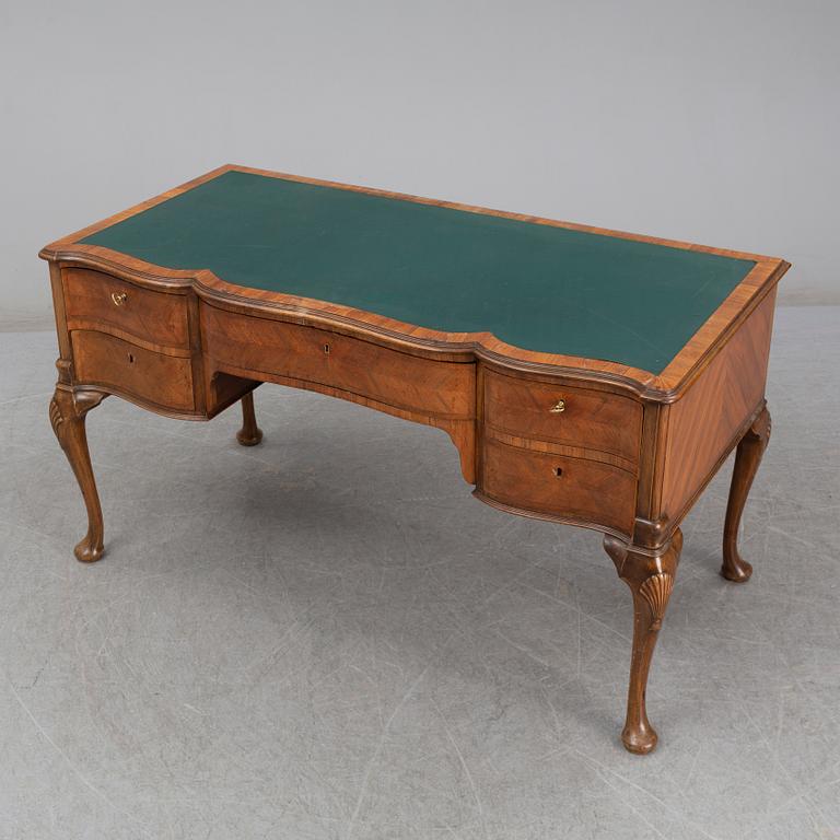 A Rococo-style circa 1900 writing desk.