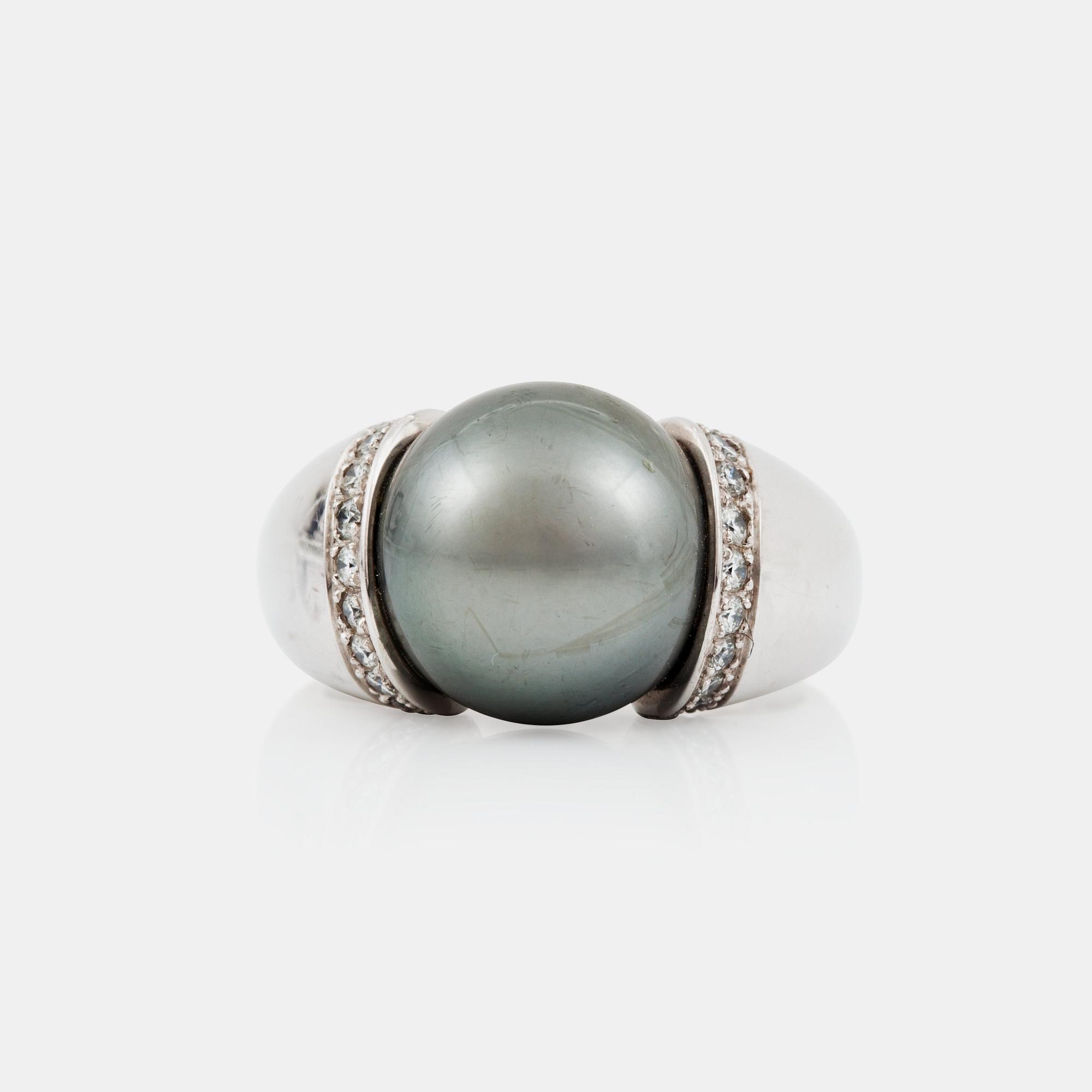 A cultured Tahiti pearl and diamond ring made by Gübelin.