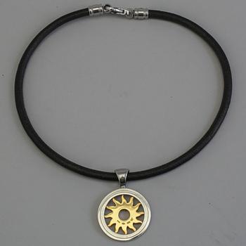 a necklace by Bvlgari "Tondo Sun Pendant".