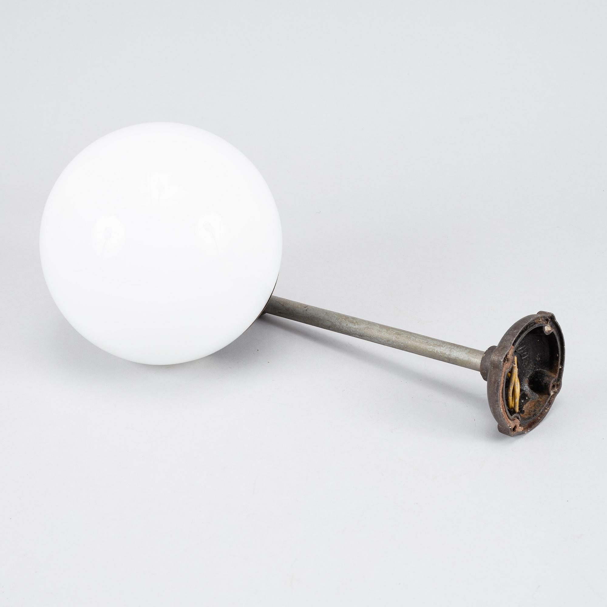 A set of four metal wall lights, first half of the 20th century.