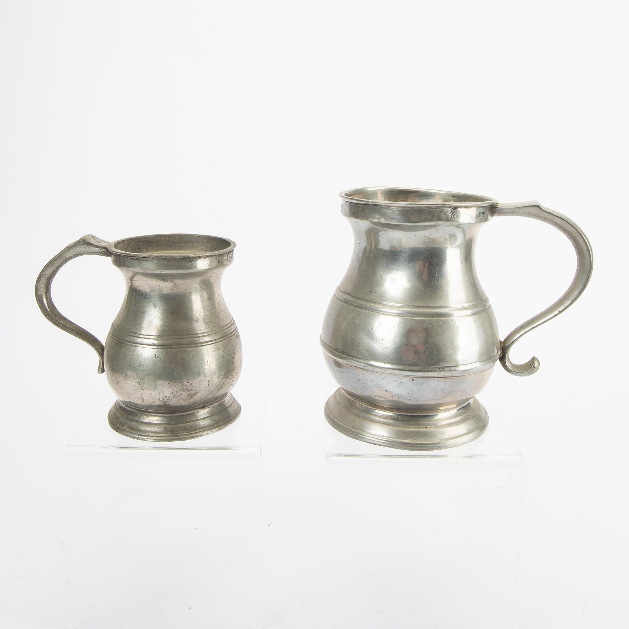 A set of five pewter tankards and six bowls England 20th century.