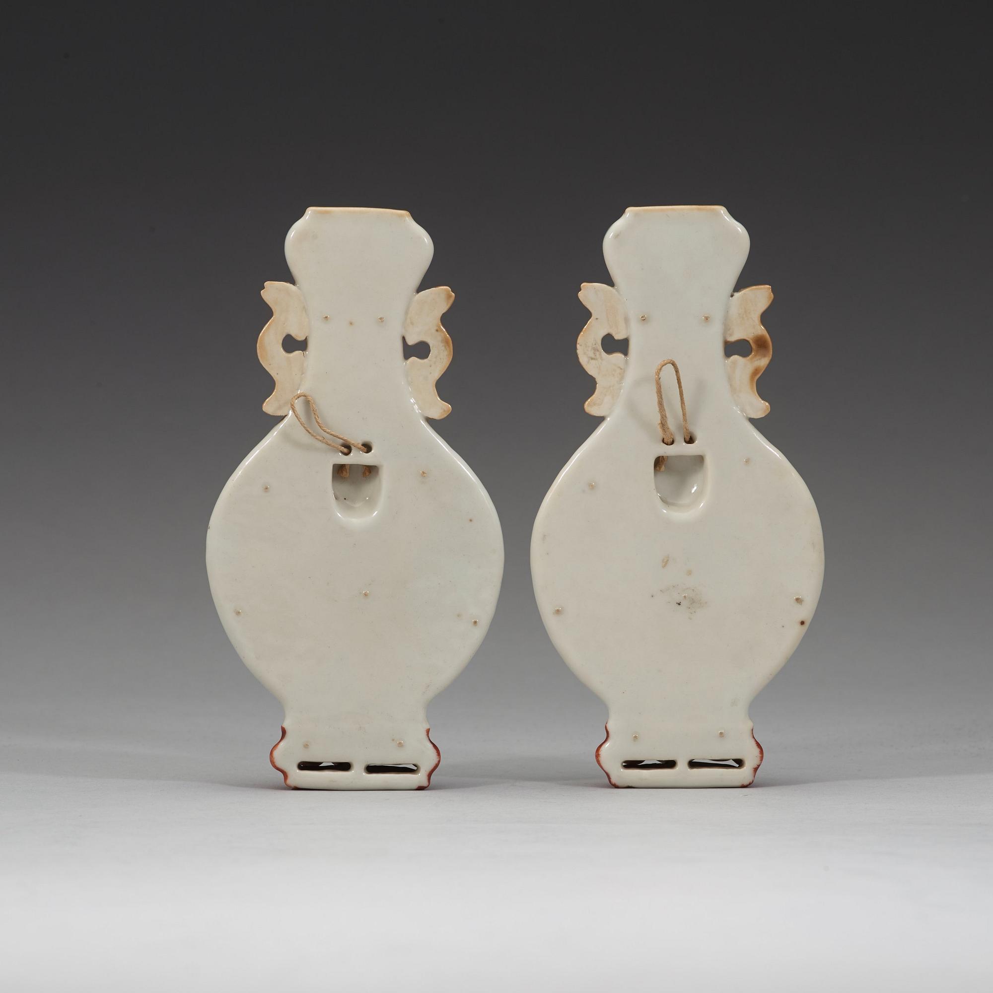 A pair of famille rose wall vases, late Qing dynasty, circa 1900.