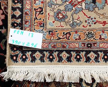 An old Tabriz carpet, c. 390 x 296 cm.