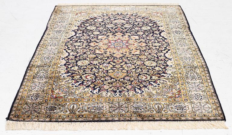 A Ghom, silk rug, c. 162 x 102 cm.
