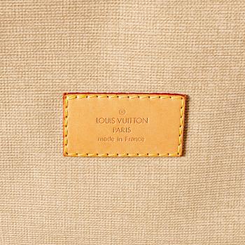 A Louis Vuitton travel bag.