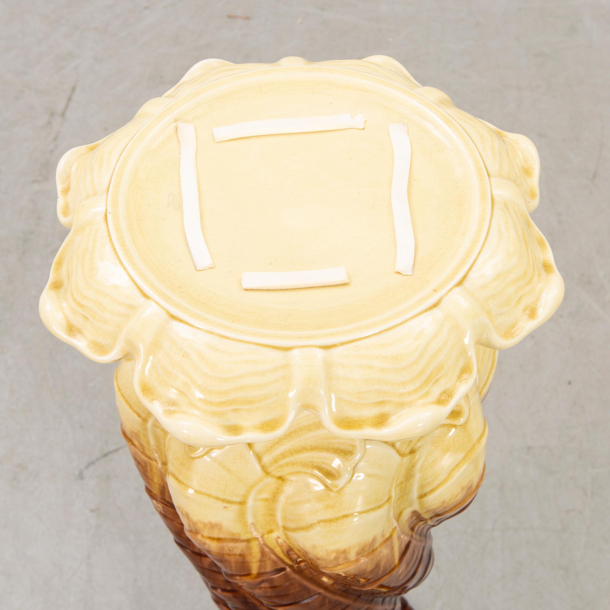 AN early 1900s majolica pedestal and flower urn.
