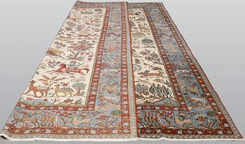 A semi-antique Ghom carpet, approx. 390 x 290 cm.