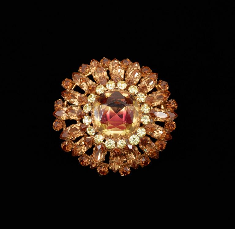 A brooch by Christian Dior.