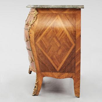 A rococo parquetry and gilt brass-mounted commode by J. J. Eisenbletter (active ca 1760-1810).